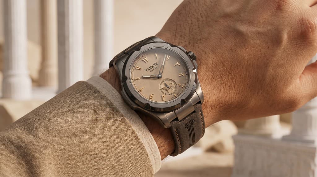Takhte-Watch worn on wrist with heritage jacket